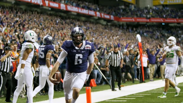 Jan 2, 2016; San Antonio, TX, USA; TCU Horned Frogs quarterback Bram Kohlhausen (6) scores the winning touchdown against the Oregon Ducks in overtime at the Valero Alamo Bowl in the Alamodome. TCU won 47-41.
